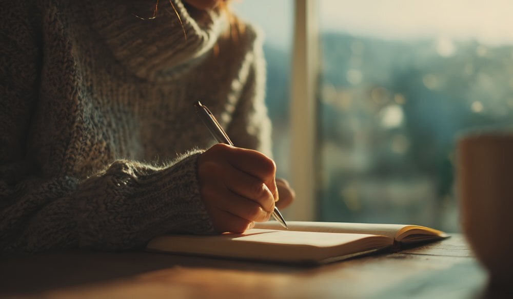 Woman Writing in Notebook